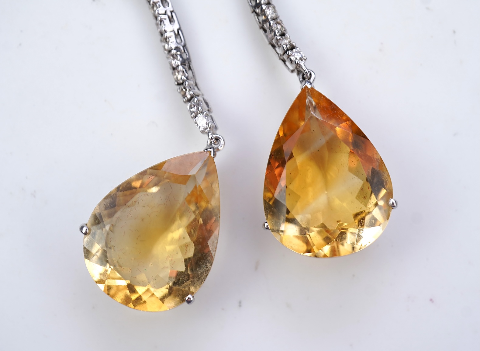 A pair of citrine and diamond earrings